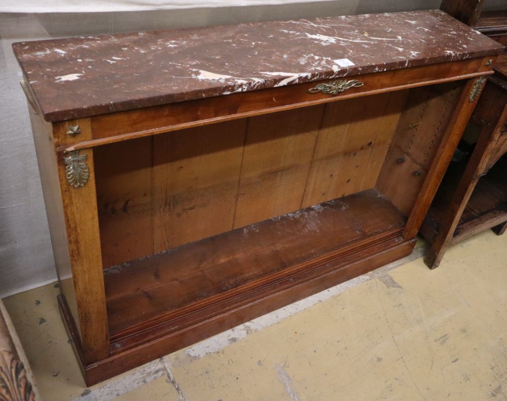 A pair of Regency style mahogany open bookcases with marble tops and brass mounts, W.120cm, D.27cm, H.84cm